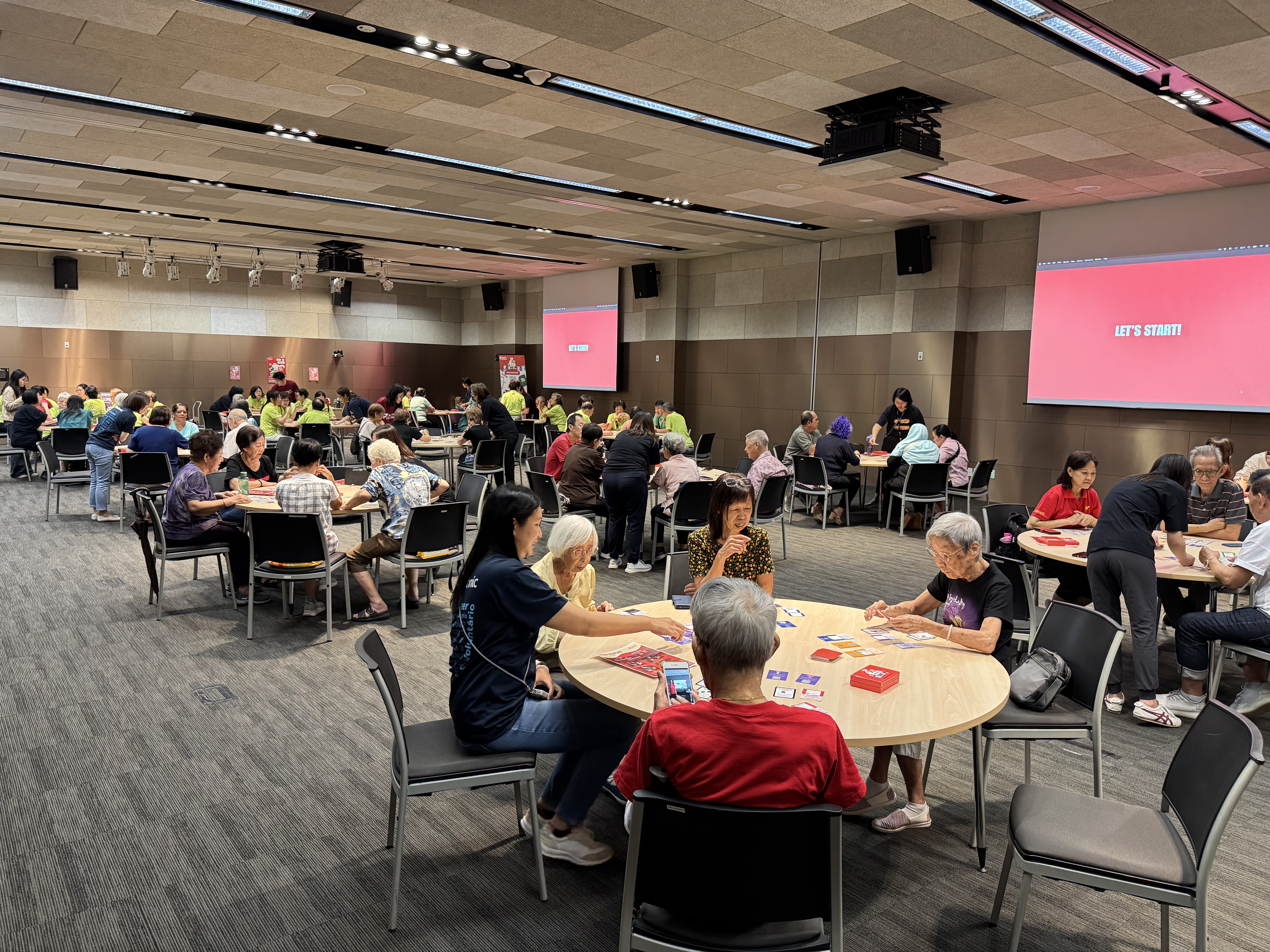 Volunteers facilitating an Impact Colliders community workshop
