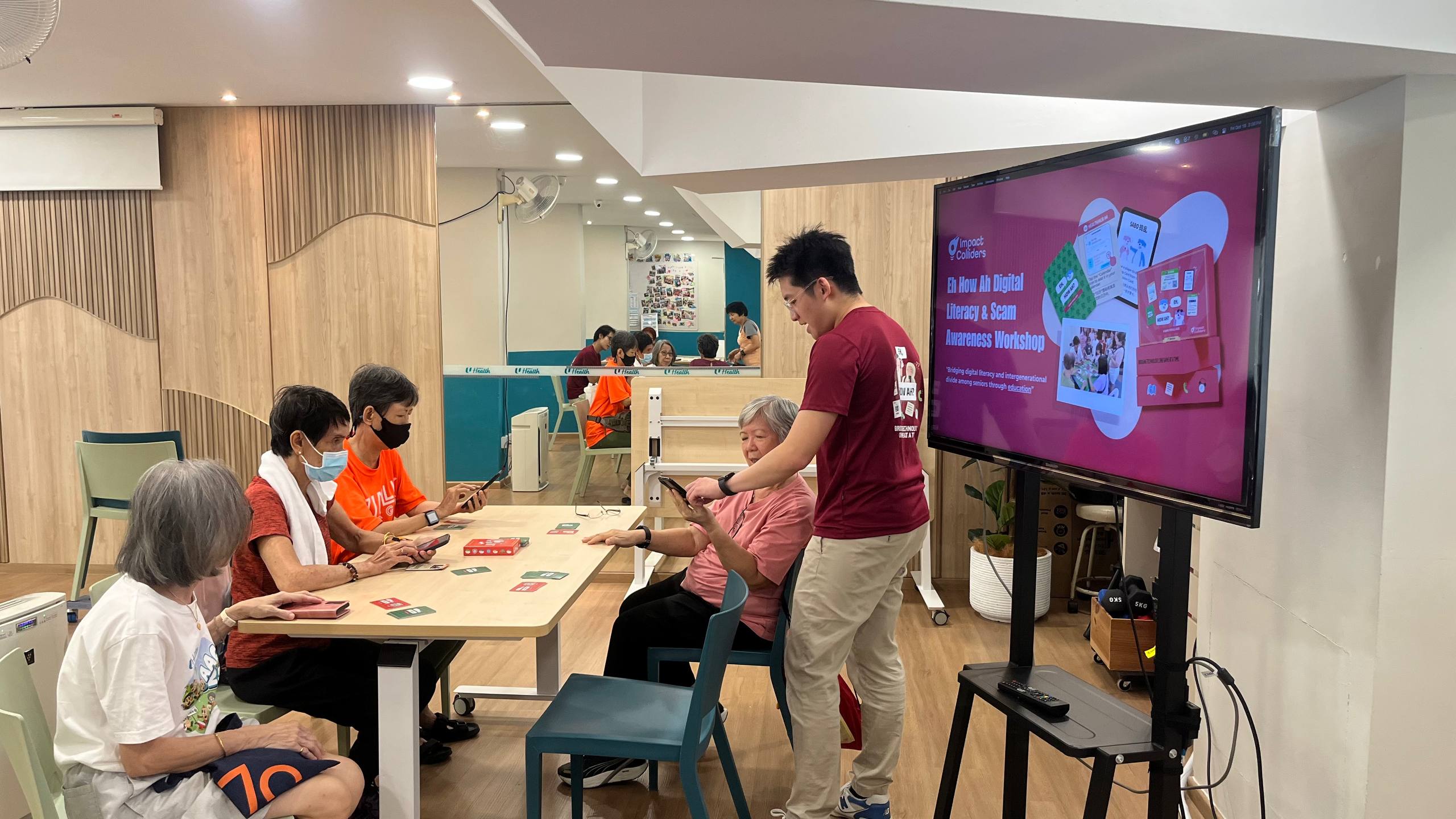 Seniors taking part in a digital literacy game workshop