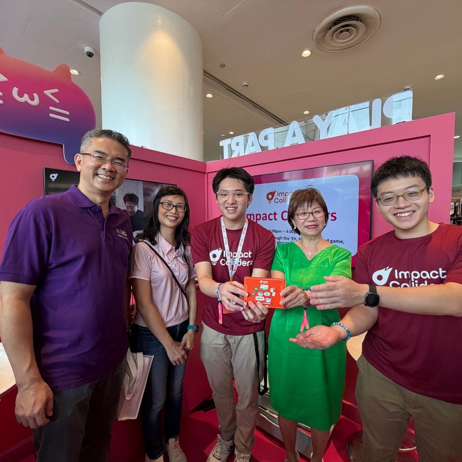 The Impact Colliders team at a community roadshow booth